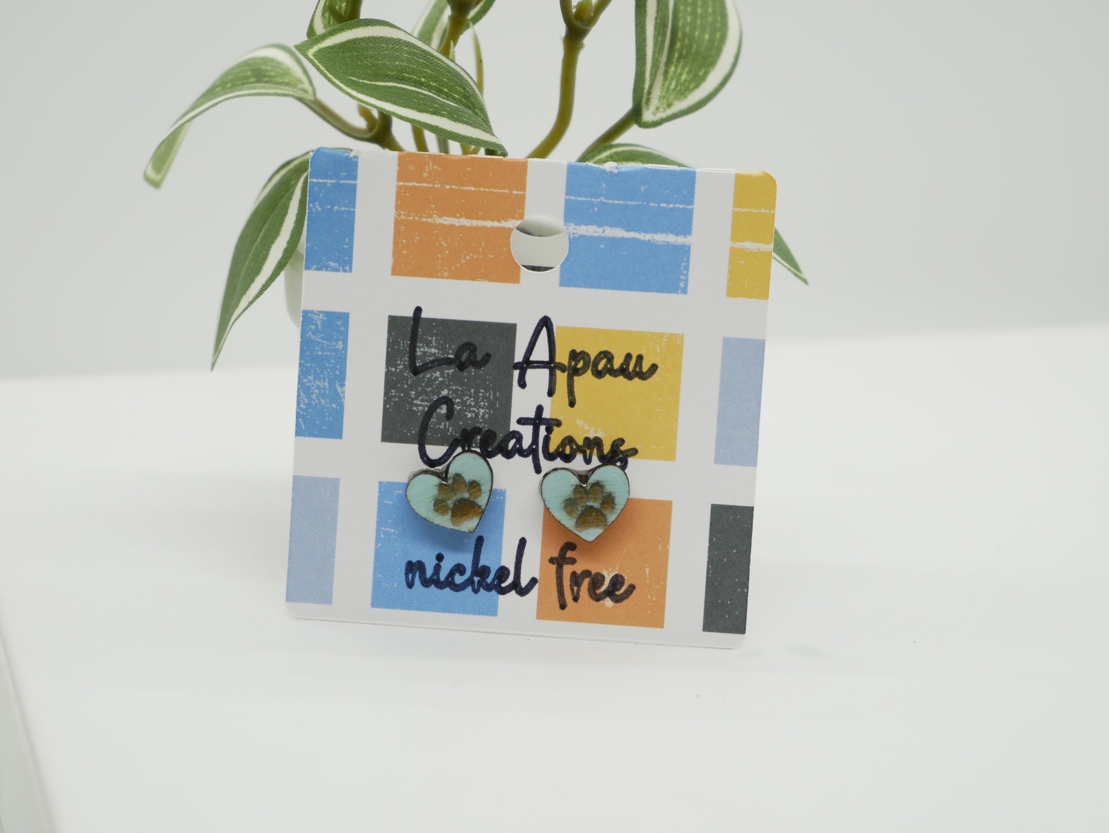 Heart earrings dog paws on 'La Apau Creations' branding 